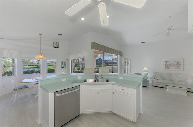 kitchen with dishwasher, lofted ceiling, sink, light hardwood / wood-style floors, and white cabinetry