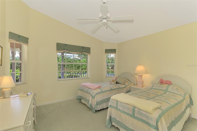 bedroom with ceiling fan, light carpet, and lofted ceiling