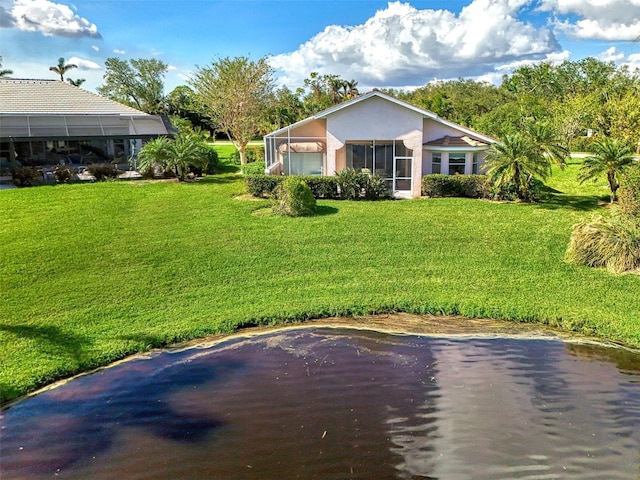 rear view of house with a yard