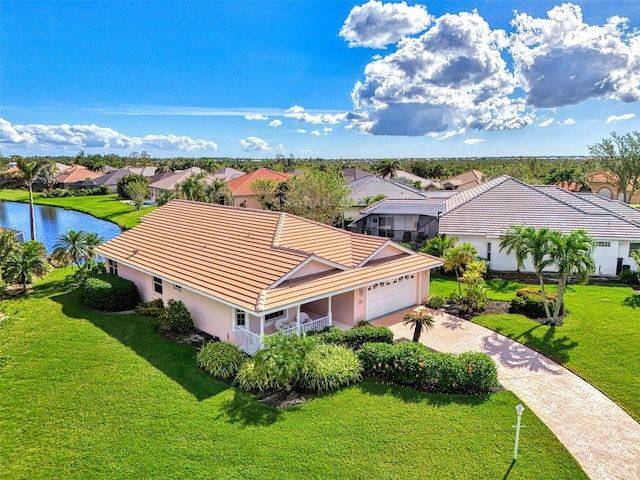 birds eye view of property with a water view