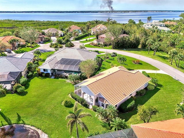 birds eye view of property with a water view