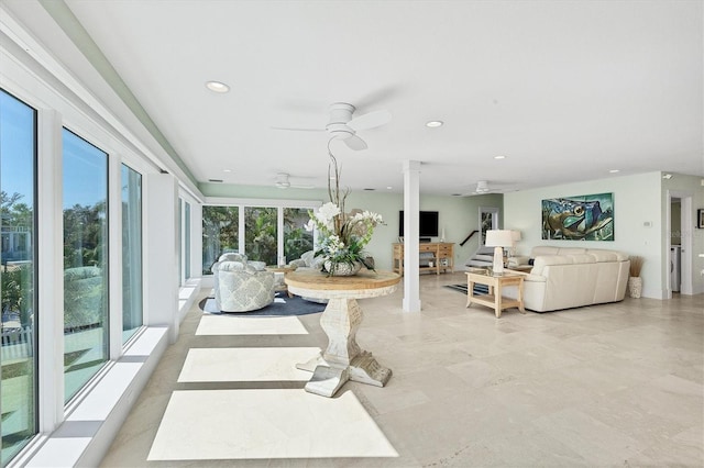 sunroom with ceiling fan