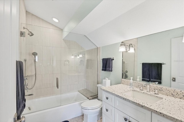 full bathroom with vanity, lofted ceiling, tile patterned floors, combined bath / shower with glass door, and toilet