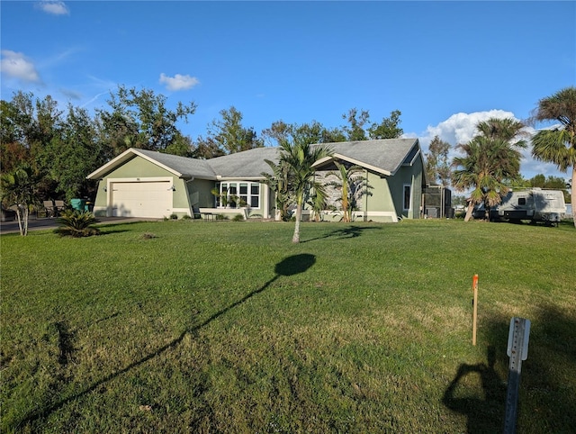 ranch-style house featuring a front lawn and a garage