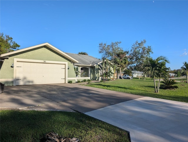 ranch-style house with a garage and a front lawn