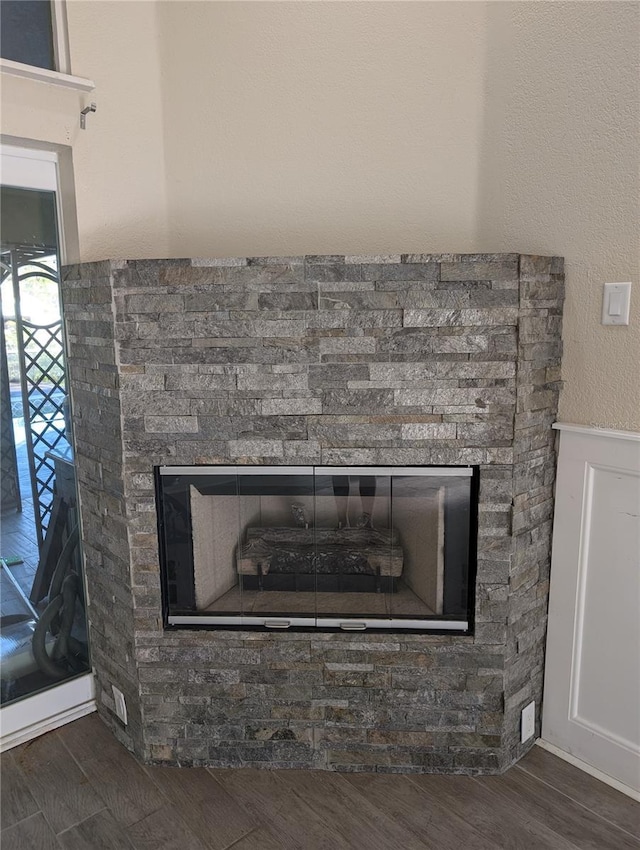 details featuring wood-type flooring and a fireplace