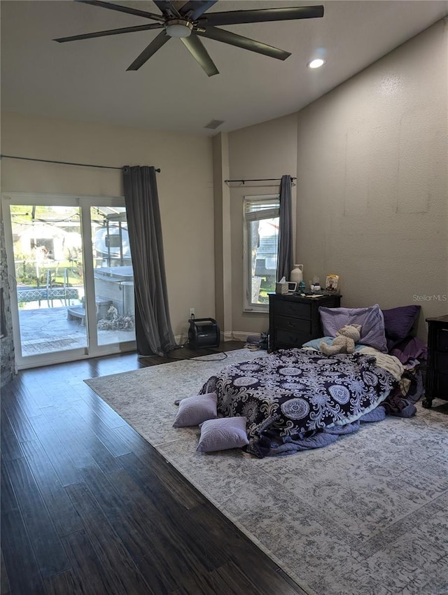 bedroom with access to outside, ceiling fan, wood-type flooring, and vaulted ceiling