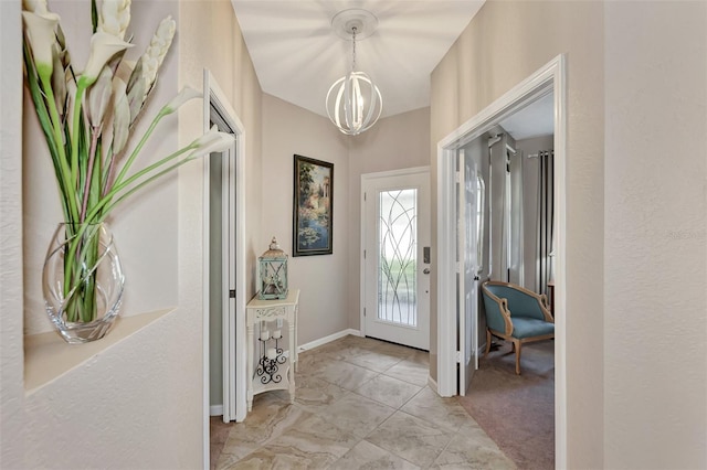 entryway with a notable chandelier