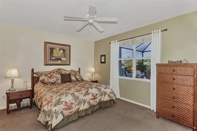 bedroom with dark carpet and ceiling fan