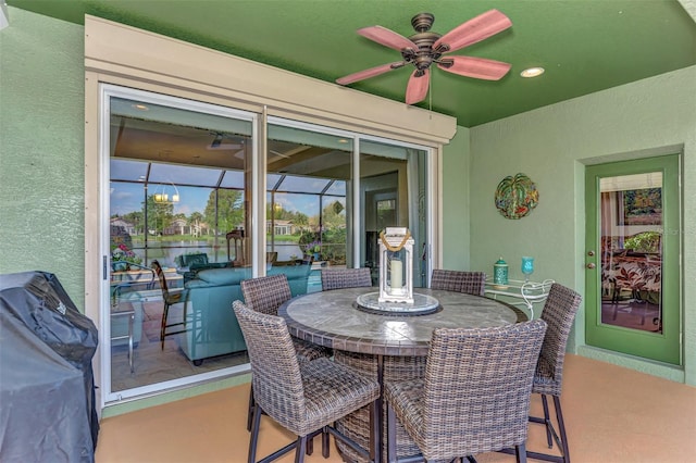 view of patio with ceiling fan and grilling area