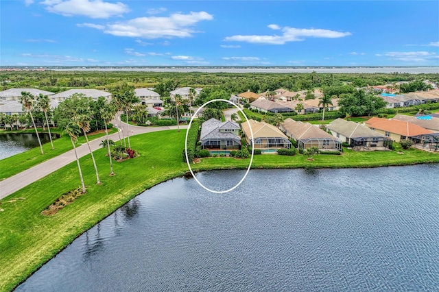 birds eye view of property with a water view