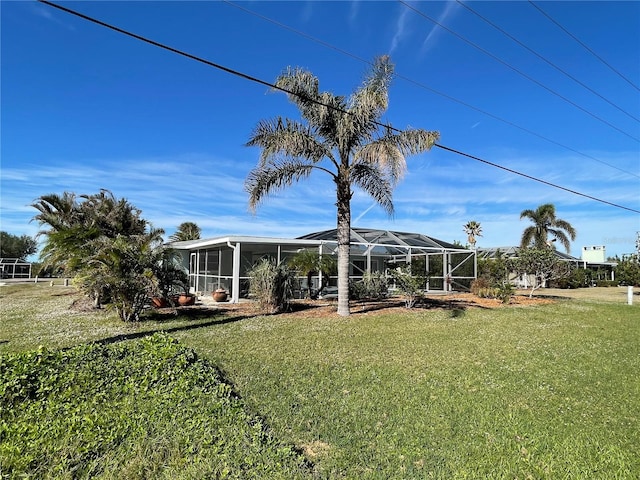 view of yard with glass enclosure