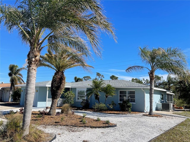 ranch-style home featuring cooling unit