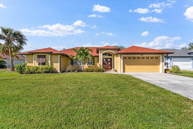 view of front facade featuring a garage and a front lawn