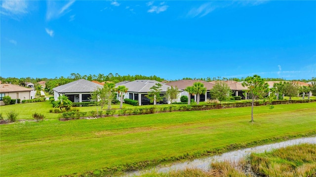 ranch-style home with a front lawn