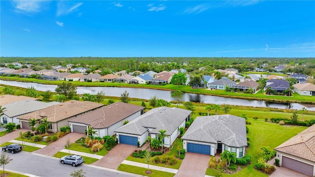 birds eye view of property featuring a water view