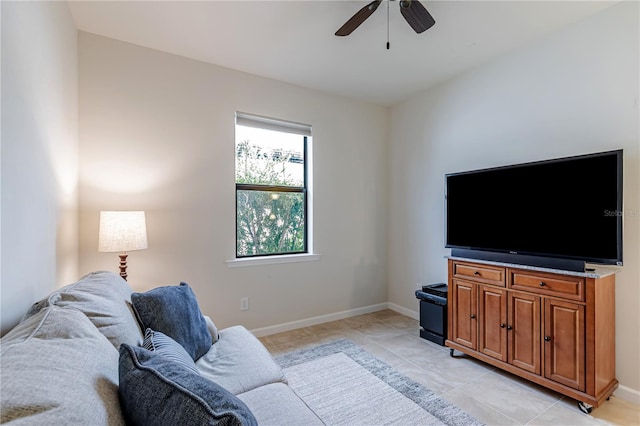 living room featuring ceiling fan and light tile patterned floors