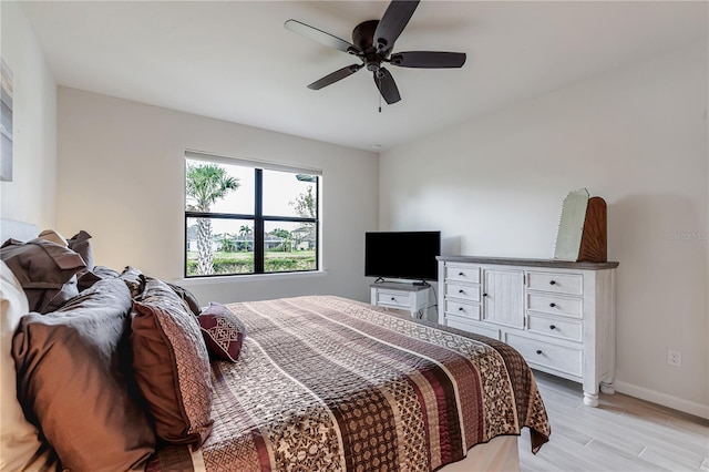 bedroom featuring ceiling fan and light hardwood / wood-style floors