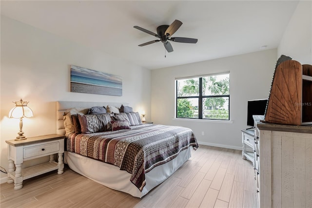 bedroom with ceiling fan and light hardwood / wood-style floors