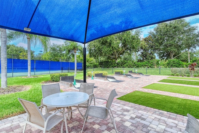 view of patio with tennis court