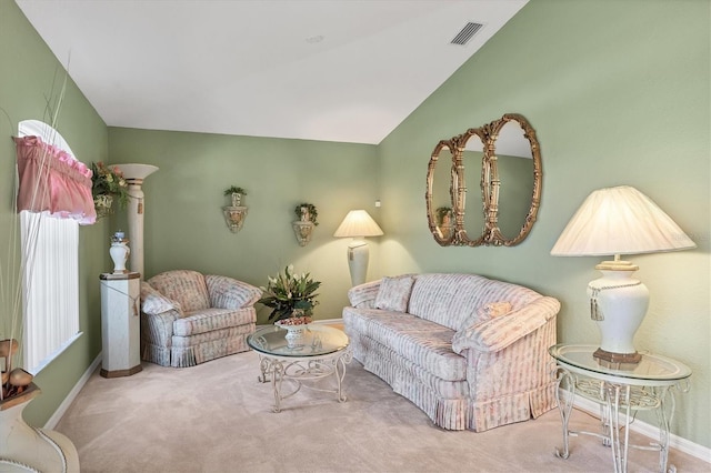 living room with vaulted ceiling and carpet