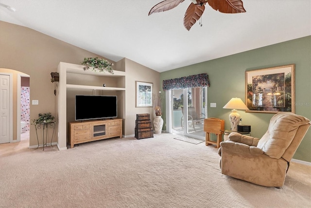 living room featuring carpet flooring, lofted ceiling, and ceiling fan