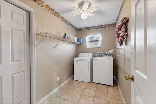 laundry room featuring washer and clothes dryer, light tile patterned floors, and ceiling fan