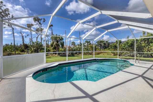 view of swimming pool featuring glass enclosure and a patio area