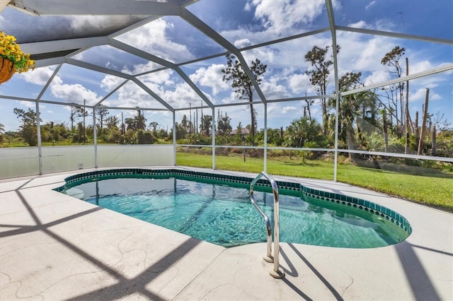 view of swimming pool featuring a lanai and a patio