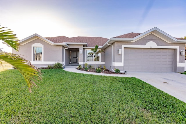 ranch-style house with a garage and a front yard