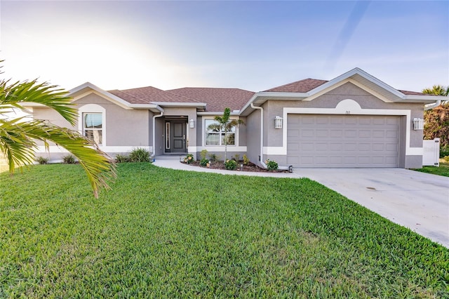 ranch-style house featuring a garage and a front yard