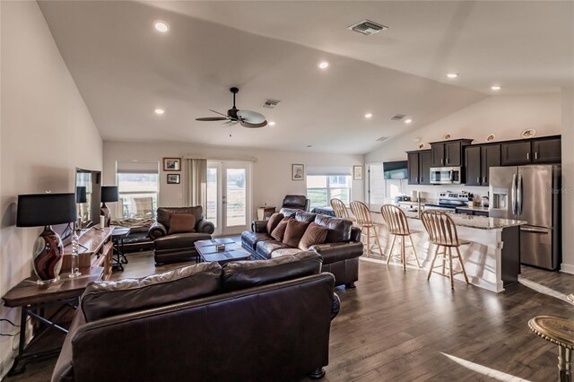 living room featuring high vaulted ceiling, dark hardwood / wood-style floors, and ceiling fan