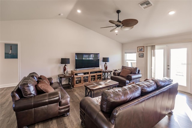 living room with hardwood / wood-style flooring, ceiling fan, and lofted ceiling