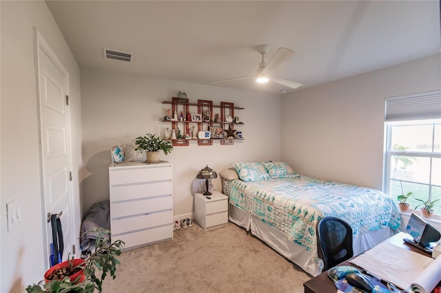 bedroom with light carpet and ceiling fan