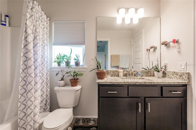 full bathroom with toilet, vanity, and shower / bathtub combination with curtain