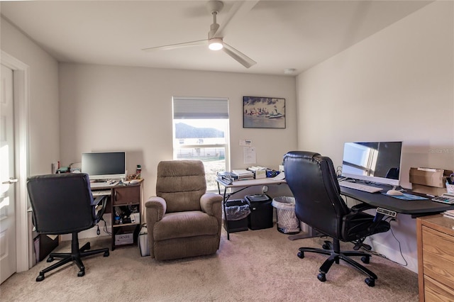 carpeted office with ceiling fan