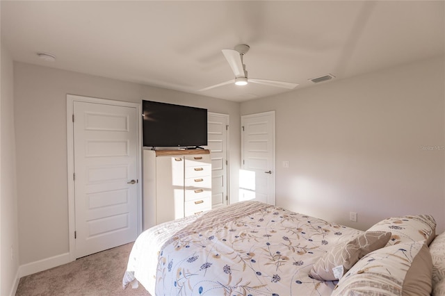 carpeted bedroom featuring ceiling fan