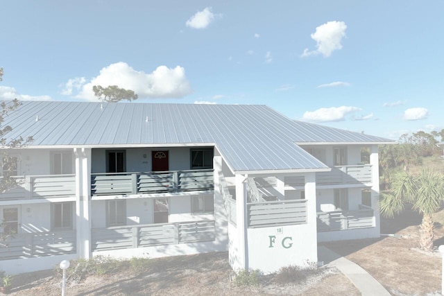 view of front of house with a balcony