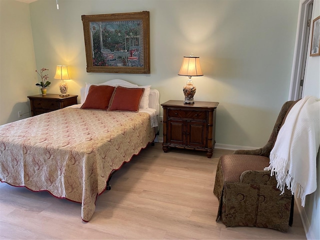 bedroom featuring light wood-type flooring