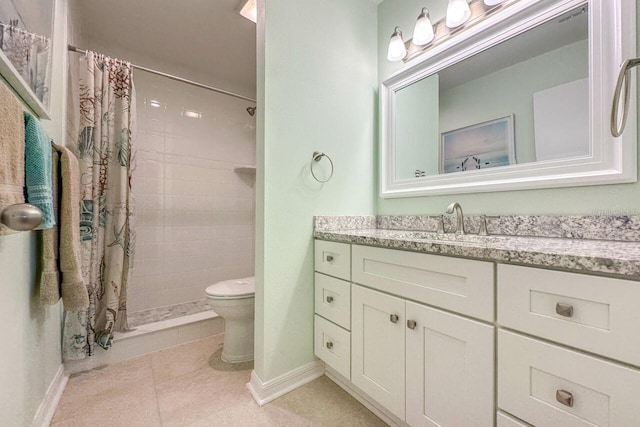 bathroom featuring vanity, tile patterned flooring, toilet, and walk in shower