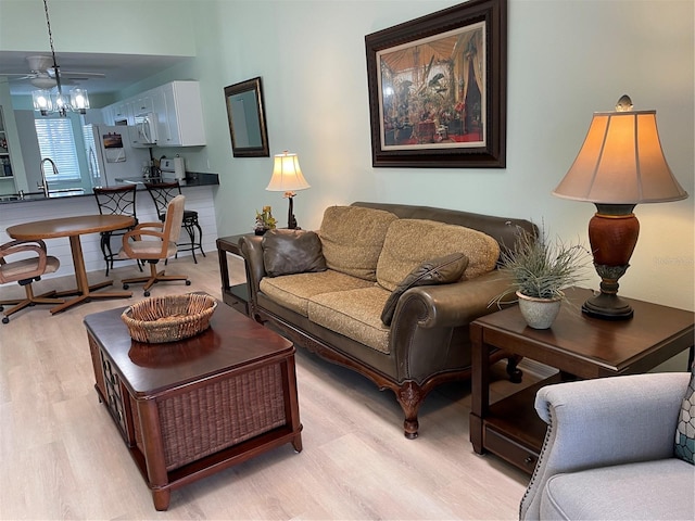 living room featuring sink and light wood-type flooring