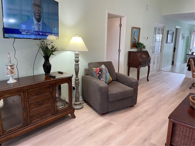 sitting room with light hardwood / wood-style flooring