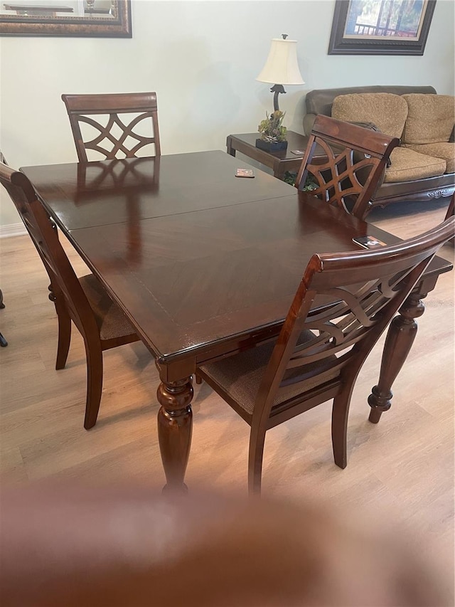 dining space featuring light hardwood / wood-style floors