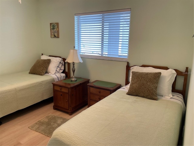 bedroom with light wood-type flooring