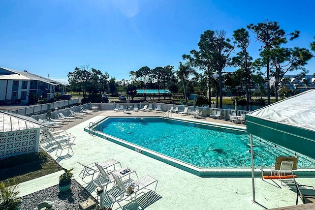 view of swimming pool with a patio