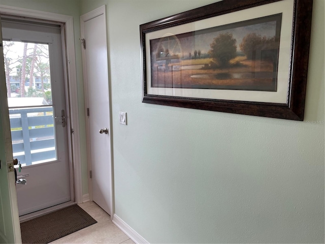 entryway with light tile patterned floors