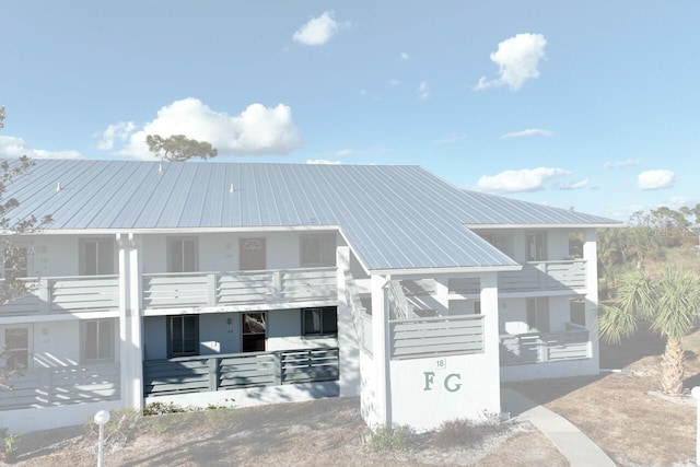 view of front of home with a balcony