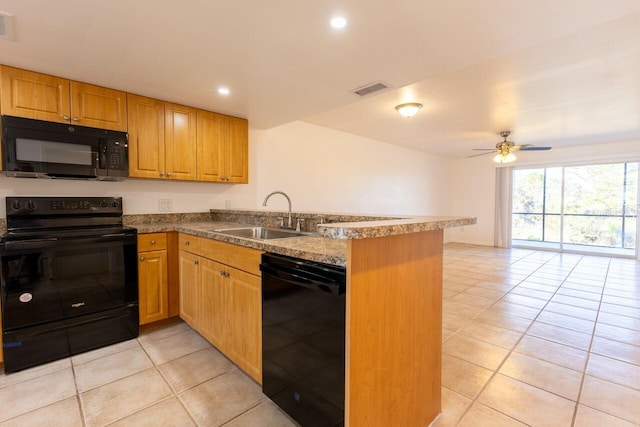 kitchen with black appliances, kitchen peninsula, sink, and light tile patterned floors