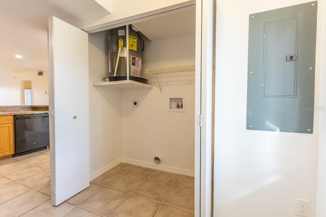 laundry room featuring hookup for a washing machine, electric panel, light tile patterned floors, and electric dryer hookup