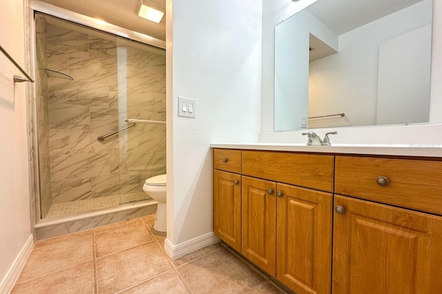 bathroom with tile patterned floors, vanity, toilet, and a shower with door